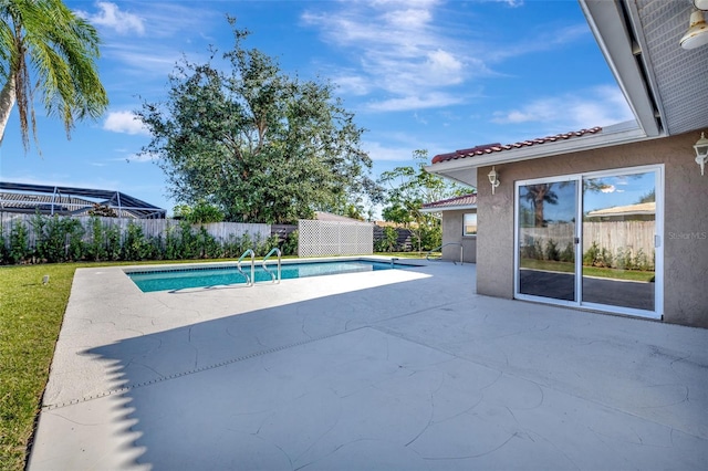 view of pool featuring a patio