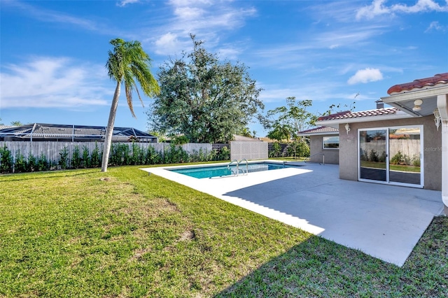 view of pool featuring a yard and a patio area