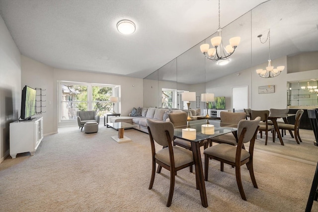 carpeted dining room with lofted ceiling and an inviting chandelier