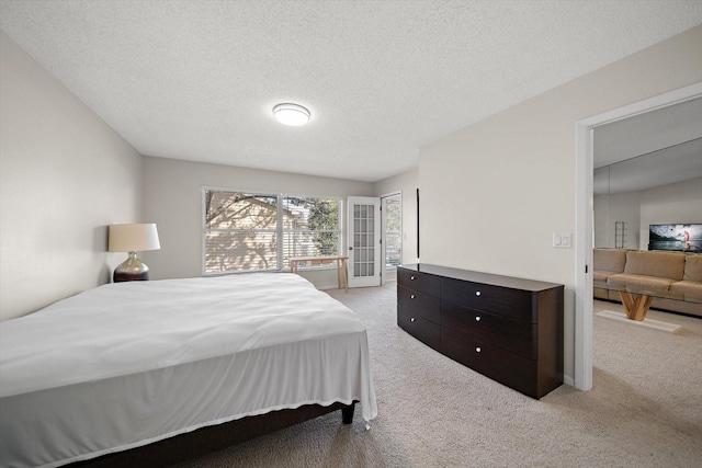 carpeted bedroom with a textured ceiling