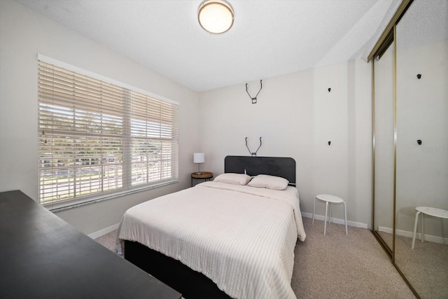 carpeted bedroom with a closet