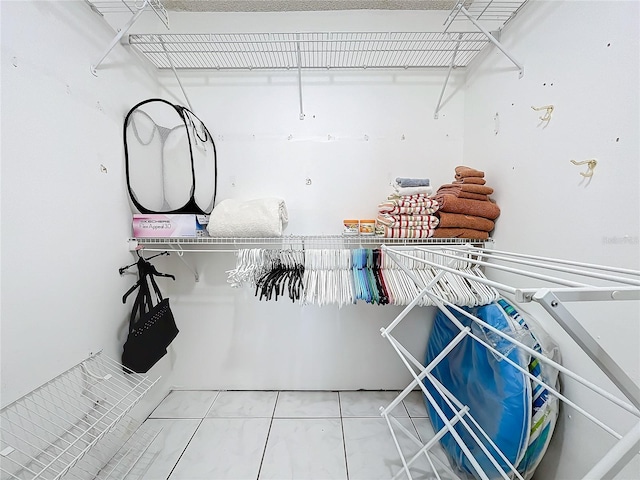 spacious closet with tile patterned flooring