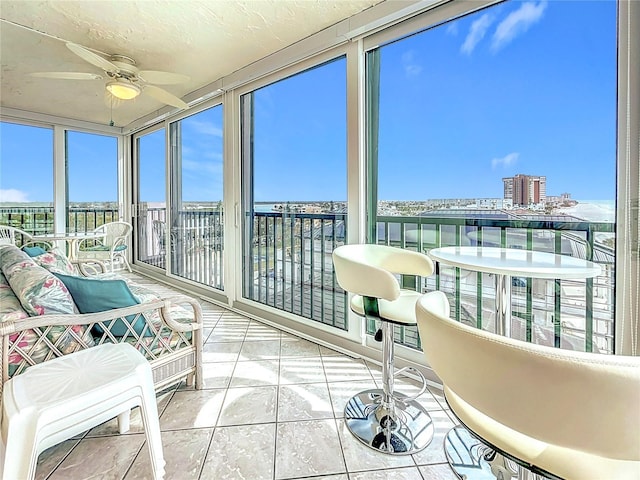 sunroom / solarium with ceiling fan