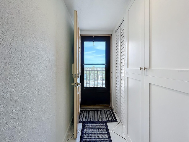 doorway featuring light tile patterned floors