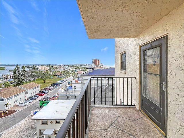 balcony featuring a water view