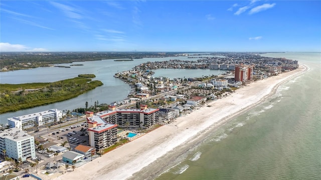 drone / aerial view with a water view and a view of the beach