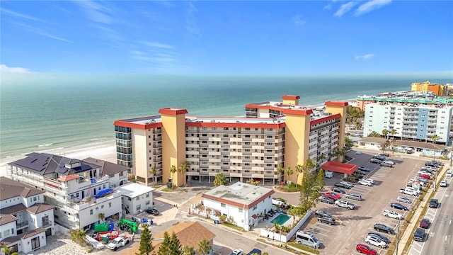 drone / aerial view with a water view and a view of the beach