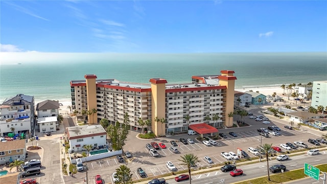 bird's eye view featuring a water view and a view of the beach