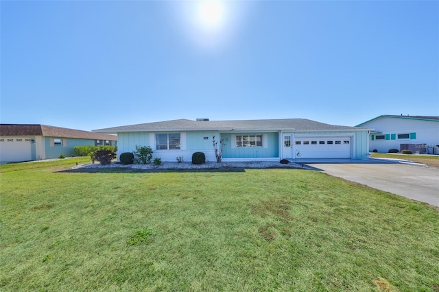 ranch-style home featuring a garage and a front lawn