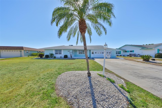 ranch-style home with a front lawn and a garage