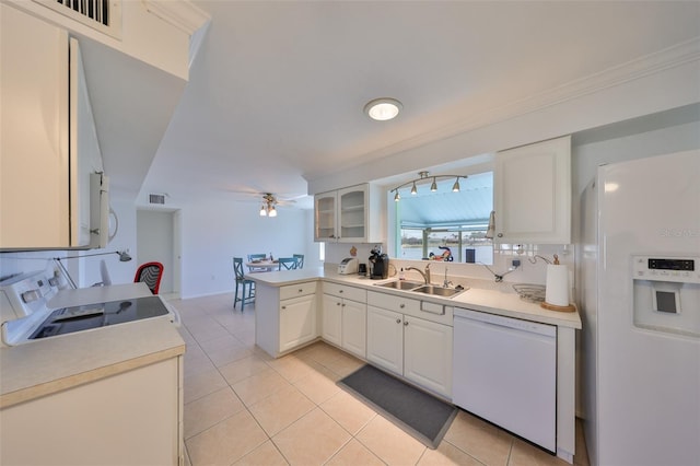 kitchen with sink, white appliances, white cabinets, and light tile patterned flooring