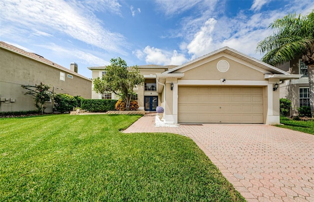 view of front of property featuring a garage and a front yard