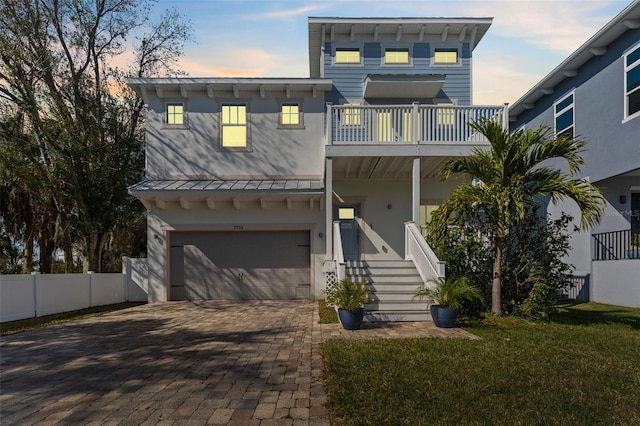 view of front facade with a yard and a garage