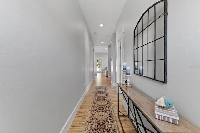 hall with light hardwood / wood-style flooring