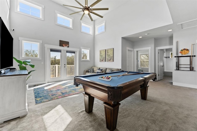 rec room featuring a towering ceiling, light carpet, pool table, and french doors