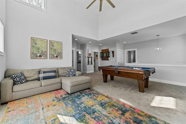 game room featuring ceiling fan, pool table, carpet, and a towering ceiling