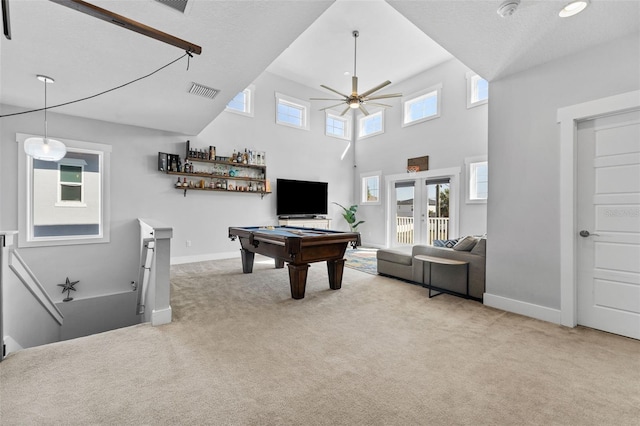 game room with a high ceiling, pool table, ceiling fan, light carpet, and french doors