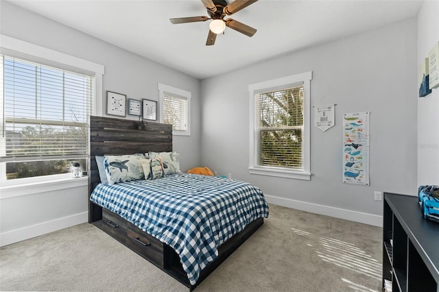 bedroom with light colored carpet and ceiling fan