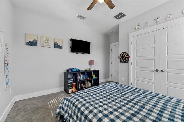 carpeted bedroom featuring ceiling fan and a closet