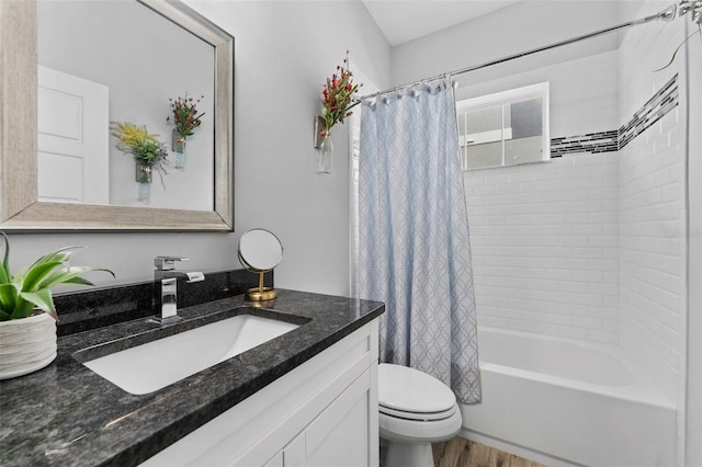 full bathroom with shower / tub combo with curtain, vanity, wood-type flooring, and toilet