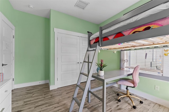 bedroom featuring light wood-type flooring