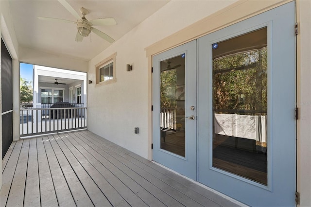 wooden deck with french doors and ceiling fan