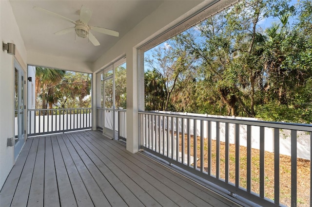 wooden terrace featuring ceiling fan