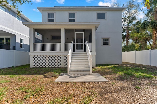 back of property featuring a sunroom