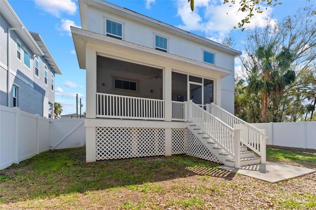 back of property featuring a sunroom