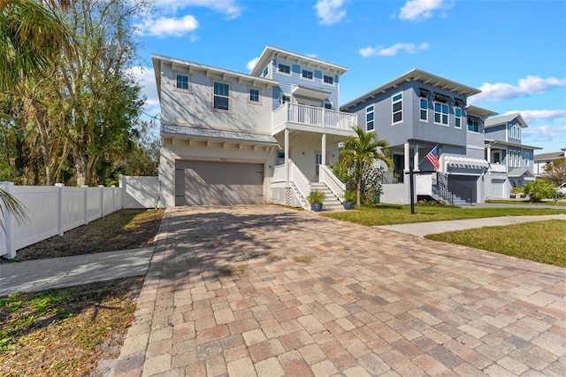 view of front of house with a balcony and a garage