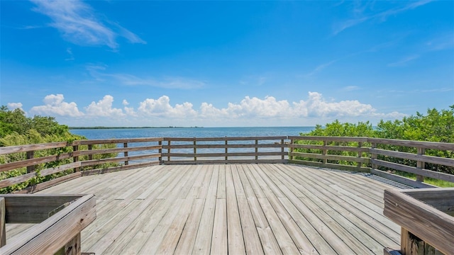 wooden terrace with a water view