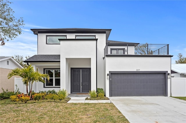 view of front of property with a garage and a front yard