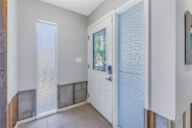 foyer with light tile patterned flooring