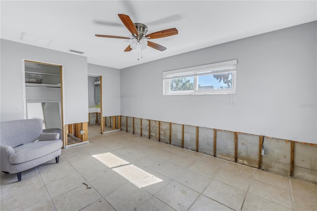 unfurnished room with ceiling fan