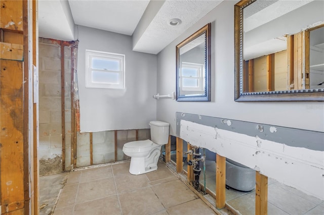 bathroom featuring tile patterned floors and toilet