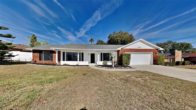 single story home featuring a garage and a front lawn