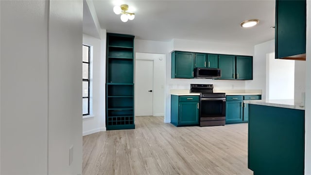 kitchen featuring appliances with stainless steel finishes and light hardwood / wood-style floors