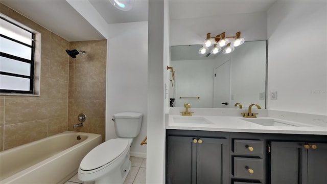 full bathroom with vanity, tile patterned floors, toilet, and tiled shower / bath