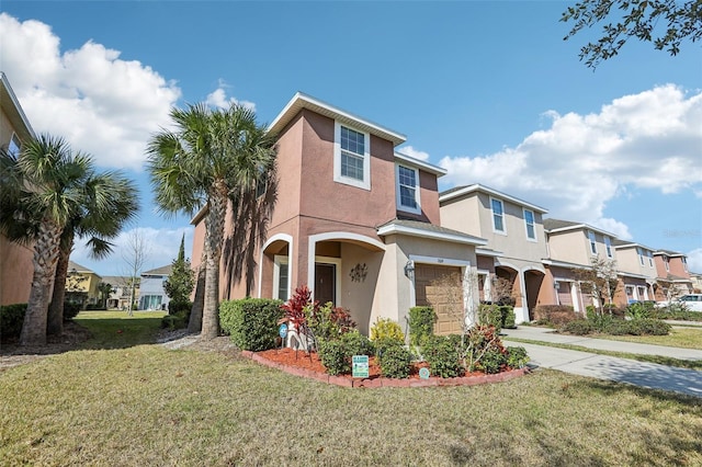 view of front of house with a garage and a front yard