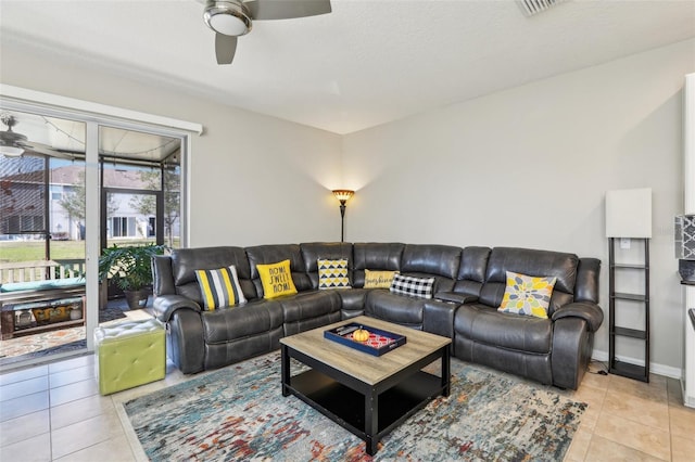 living room with light tile patterned floors and ceiling fan