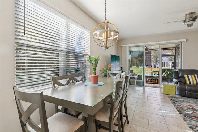 dining room with a notable chandelier and light tile patterned floors