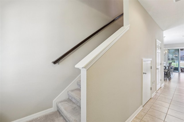 stairs with tile patterned flooring