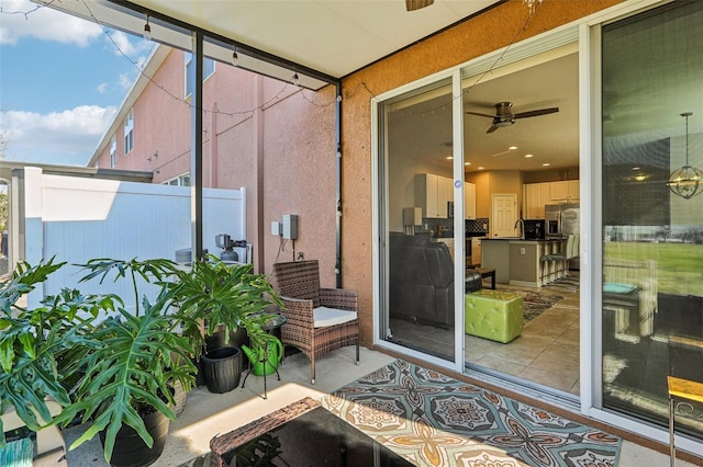 view of patio / terrace featuring ceiling fan