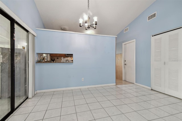 unfurnished dining area with vaulted ceiling, light tile patterned floors, and a notable chandelier