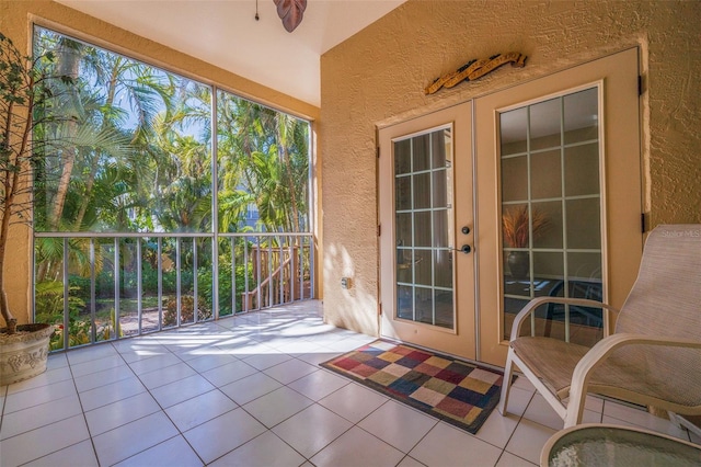 unfurnished sunroom featuring french doors