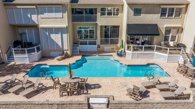 view of pool featuring a patio area