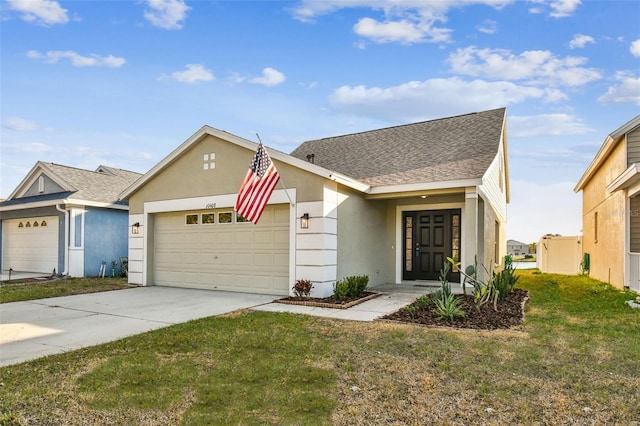 view of front facade featuring a garage and a front lawn