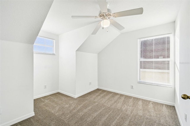 bonus room with vaulted ceiling, carpet floors, and ceiling fan