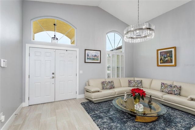 living room featuring vaulted ceiling and a notable chandelier