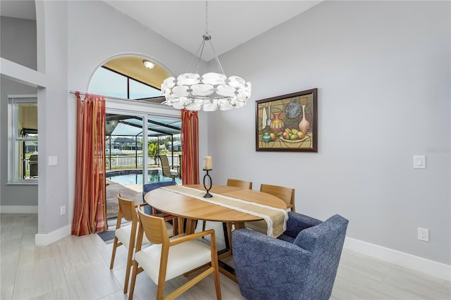 tiled dining space with vaulted ceiling